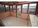 Sunroom with multiple windows and built-in cabinetry at 2913 & 2901 Wesleyan Church Rd, Lincolnton, NC 28092