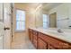 Bathroom with double vanity and tiled floor at 3043 Streamlet Way, Monroe, NC 28110