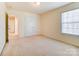 Bedroom with double doors and hallway access at 3043 Streamlet Way, Monroe, NC 28110