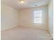 Bright bedroom with window and neutral walls at 3043 Streamlet Way, Monroe, NC 28110