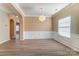 Bright dining room features hardwood floors, wainscoting, and a large window with blinds at 3043 Streamlet Way, Monroe, NC 28110