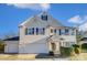 Two-story house with beige siding, dark shutters, and a two-car garage at 3043 Streamlet Way, Monroe, NC 28110