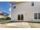Two-story house with sliding glass doors and backyard patio at 3043 Streamlet Way, Monroe, NC 28110
