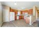 Kitchen with granite countertops, wood cabinets, and stainless steel appliances at 3043 Streamlet Way, Monroe, NC 28110