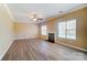 Spacious living room featuring hardwood floors and a gas fireplace at 3043 Streamlet Way, Monroe, NC 28110