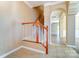 Staircase with wood and white railings leading to the upper level at 3043 Streamlet Way, Monroe, NC 28110