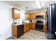 Galley kitchen with wood cabinets, stainless steel appliances and flooring at 3071 Brookchase Blvd, Fort Mill, SC 29707