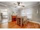 Bright dining area with hardwood floors and a view into the kitchen at 402 Fisher St, Concord, NC 28027