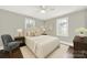 Comfortable bedroom featuring a queen bed, bedside tables with lamps, and ample natural light at 409 Jones S Ave, Rock Hill, SC 29730