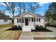 Charming white house with a well-manicured lawn and walkway at 409 Jones S Ave, Rock Hill, SC 29730