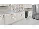 Renovated kitchen features white cabinets, stainless steel appliances, and quartz countertops at 409 Jones S Ave, Rock Hill, SC 29730