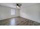 Spacious bedroom with ceiling fan and window at 438 Stoneycreek Ln, Rock Hill, SC 29730