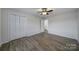 Charming bedroom with ceiling fan and double door closet at 438 Stoneycreek Ln, Rock Hill, SC 29730