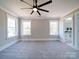 Bright bedroom with ceiling fan and grey carpeting at 604 Impala Dr, Albemarle, NC 28001