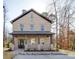 Two-story brick home with a front porch and landscaping at 604 Impala Dr, Albemarle, NC 28001