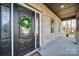 Dark brown front door with sidelights and a wreath at 604 Impala Dr, Albemarle, NC 28001