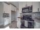 Modern kitchen with granite countertops and stainless steel appliances at 604 Impala Dr, Albemarle, NC 28001