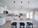 Modern kitchen with white cabinets, granite counters, and island at 604 Impala Dr, Albemarle, NC 28001
