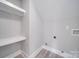 Laundry area with white shelving and vinyl flooring at 604 Impala Dr, Albemarle, NC 28001