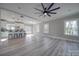 Spacious living area with hardwood floors and ceiling fan at 604 Impala Dr, Albemarle, NC 28001