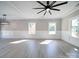 Spacious living area with hardwood floors, ceiling fan, and wainscoting at 604 Impala Dr, Albemarle, NC 28001