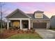 Attractive craftsman style home with stone accents and a welcoming front porch at 687 Poplar View Nw Dr, Concord, NC 28027