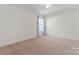 Bright bedroom with carpeted floor and rainbow curtains at 9321 Bayview Pkwy, Charlotte, NC 28216