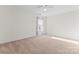 Spacious bedroom featuring carpet flooring and a ceiling fan at 9321 Bayview Pkwy, Charlotte, NC 28216