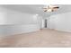 Spacious bonus room with carpet flooring and access to hallway at 9321 Bayview Pkwy, Charlotte, NC 28216