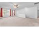 Bright bonus room with carpet flooring and window with curtains at 9321 Bayview Pkwy, Charlotte, NC 28216