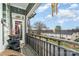 Charming balcony offers scenic views with a wooden railing and decorative planters at 935 Mcalway Rd # 306, Charlotte, NC 28211