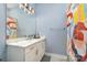 Modern bathroom featuring a single sink vanity with a decorative shower curtain at 935 Mcalway Rd # 306, Charlotte, NC 28211