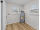 Laundry room with linoleum flooring, water heater, and windows at 1004 N Salisbury Ave, Spencer, NC 28159