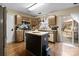 Kitchen boasts an island and access to the backyard at 1032 Enderbury Dr, Indian Trail, NC 28079