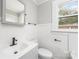 Updated bathroom with gray vanity and white shiplap walls at 123 Lincoln St, Statesville, NC 28677