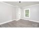 Simple bedroom with hardwood floors and a window at 123 Lincoln St, Statesville, NC 28677