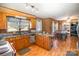 Open kitchen with wood cabinets and a view of dining area at 1331 Stegall Rd, Marshville, NC 28103