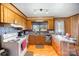 U-shaped kitchen with wood cabinets and a window at 1331 Stegall Rd, Marshville, NC 28103