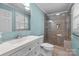 Updated bathroom with a walk-in shower and white vanity at 1714 Philadelphia Church Rd, Dallas, NC 28034