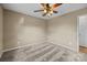 Bedroom with carpet, ceiling fan and door to hallway at 1714 Philadelphia Church Rd, Dallas, NC 28034