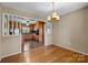 Bright dining room with hardwood floors and view of kitchen at 1714 Philadelphia Church Rd, Dallas, NC 28034