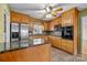 Kitchen with oak cabinets, granite countertops, and stainless steel appliances at 1714 Philadelphia Church Rd, Dallas, NC 28034