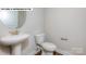Clean and modern bathroom with pedestal sink and toilet at 193 Asmodean Ln, Troutman, NC 28166