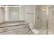 Bathroom boasts granite vanity, shower, and toilet at 193 Asmodean Ln, Troutman, NC 28166