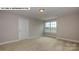 Bright bedroom with a window and neutral walls at 193 Asmodean Ln, Troutman, NC 28166
