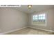 Bright bedroom featuring a large window and neutral walls at 193 Asmodean Ln, Troutman, NC 28166