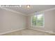 Bright bedroom featuring a large window and neutral decor at 193 Asmodean Ln, Troutman, NC 28166