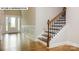 Bright entryway with hardwood floors and elegant staircase at 193 Asmodean Ln, Troutman, NC 28166