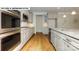 Modern kitchen with stainless steel appliances and hardwood floors at 193 Asmodean Ln, Troutman, NC 28166