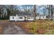 Property view showcasing a house and expansive yard with mature trees at 1940 33Rd Ne Ave, Hickory, NC 28601